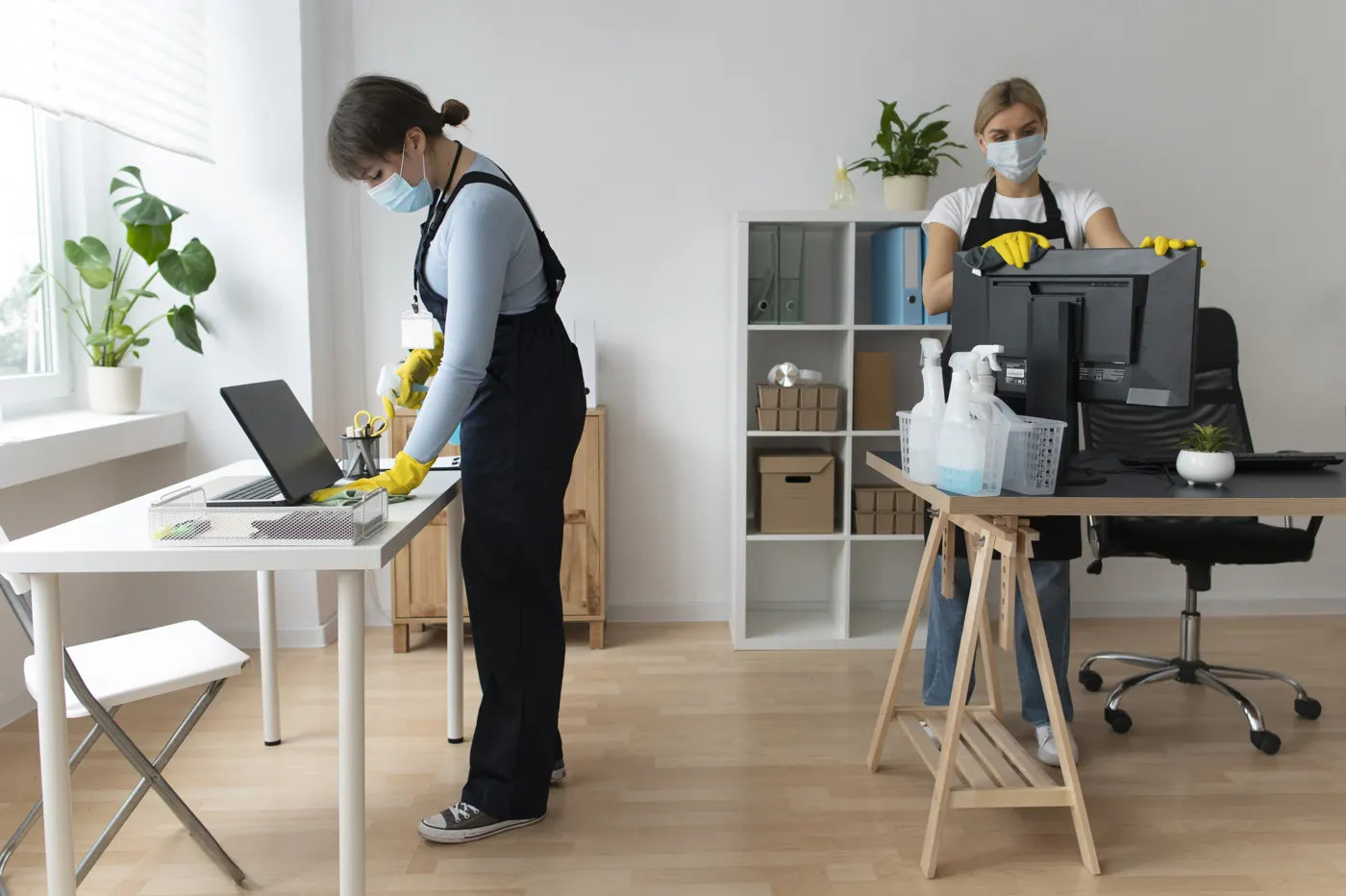 Professional cleaners looking after an office